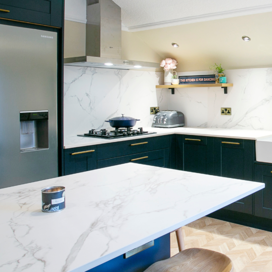 Dark Shaker Style Kitchen, Navy Kitchen, white marble style worktops and splashbacks - Tall Feature Image -Designed by John Willox Kitchen Design