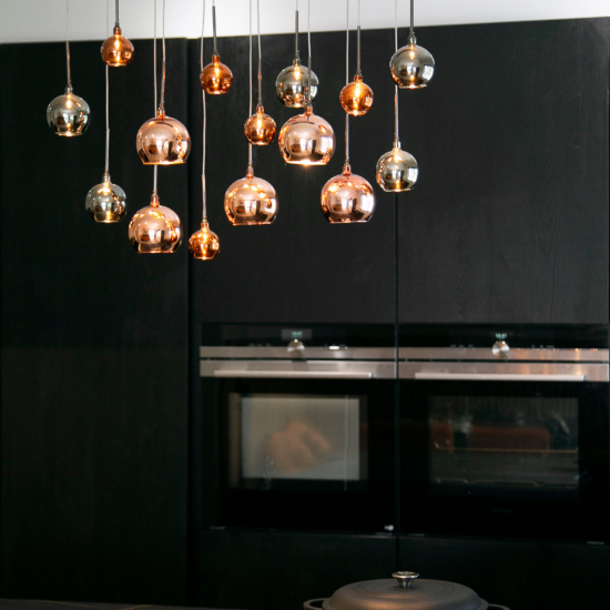 Dark Wood Handless Kitchen with Brass lighting. Designed by John Willox Kitchen Design