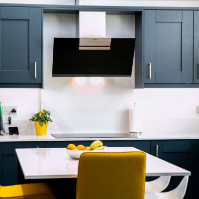 Navy Blue Shaker Kitchen with white worktops and upstands. Designed by John Willox Kitchen Design.