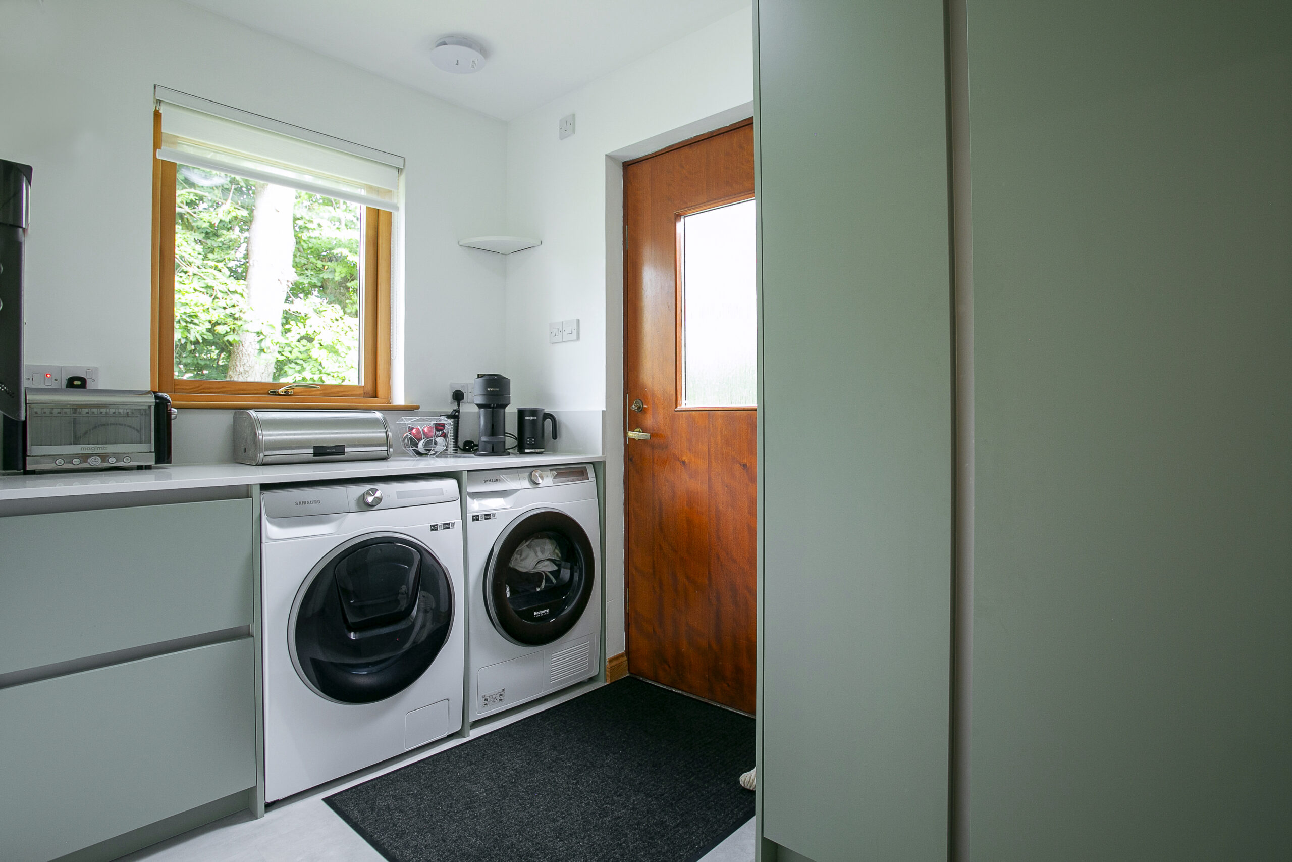 Green and white Utility Space by John Willox Kitchen Design, Ellon, Aberdeenshire