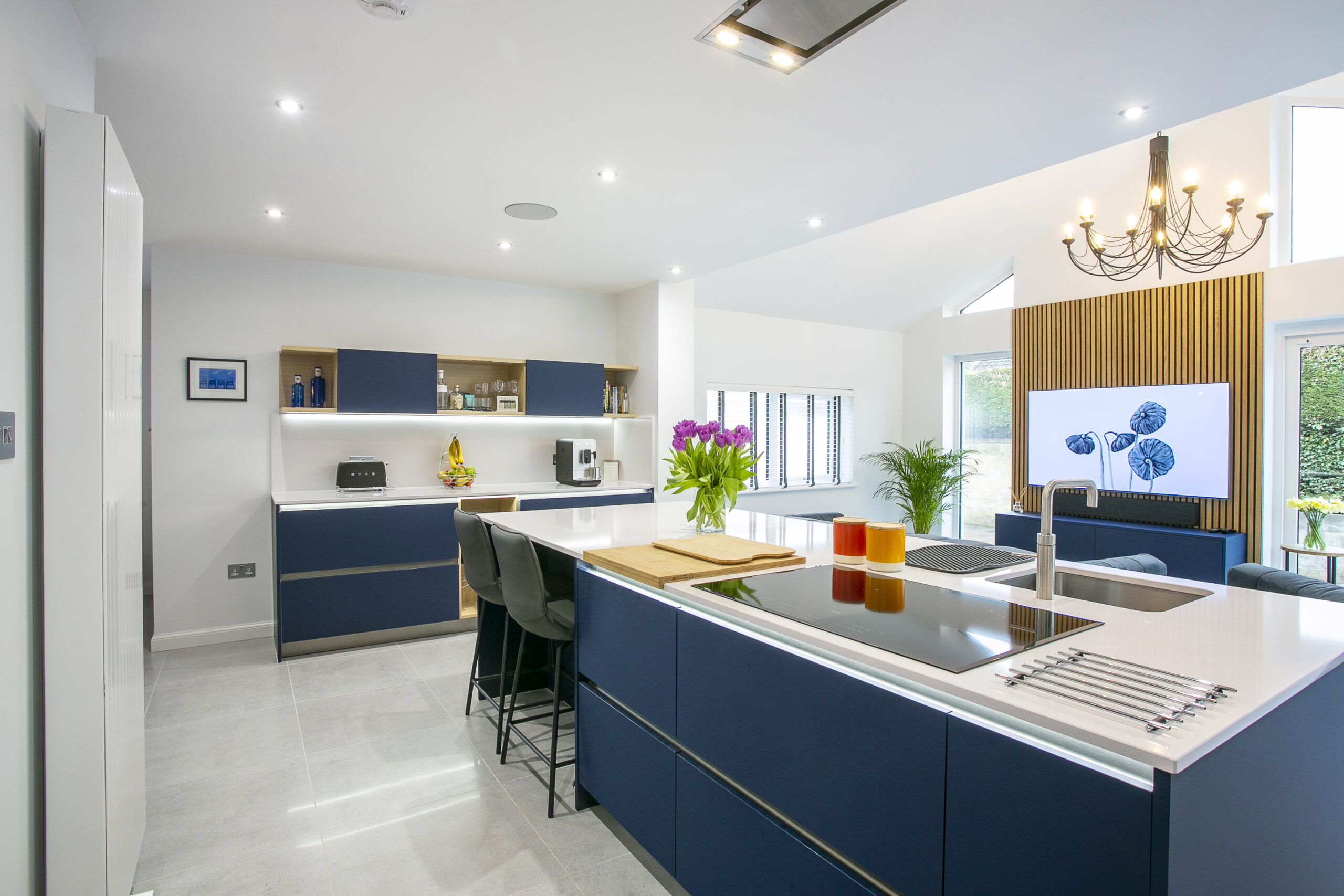 Island, prep area, open plan kitchen to livingroom space. Breathtaking Blue Kitchen by John Willox Kitchen Design