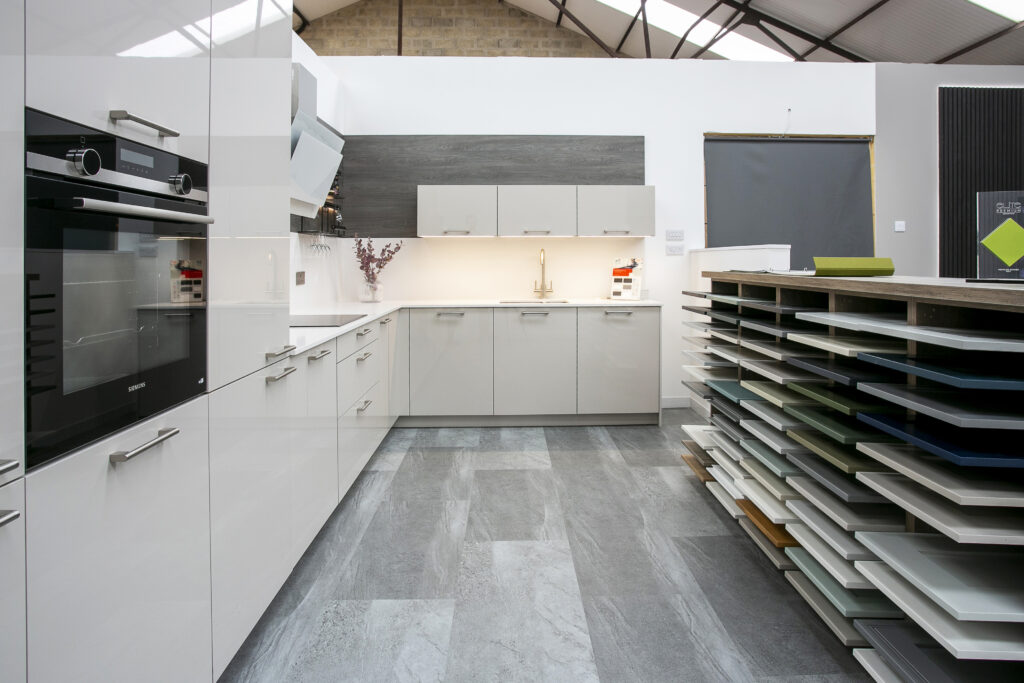 John Willox Kitchen Design Showroom with light grey kitchen. Door Display unit. Kitchen Design Aberdeen.