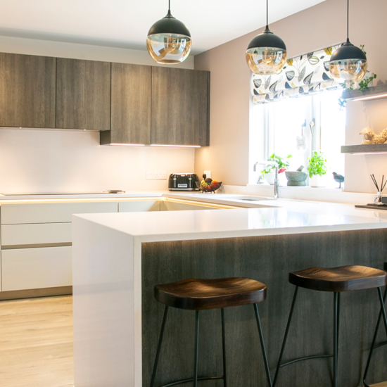 Open plan kitchen with white and timber effect. Feature Image 1. Designed by John Willox Kitchen Design.