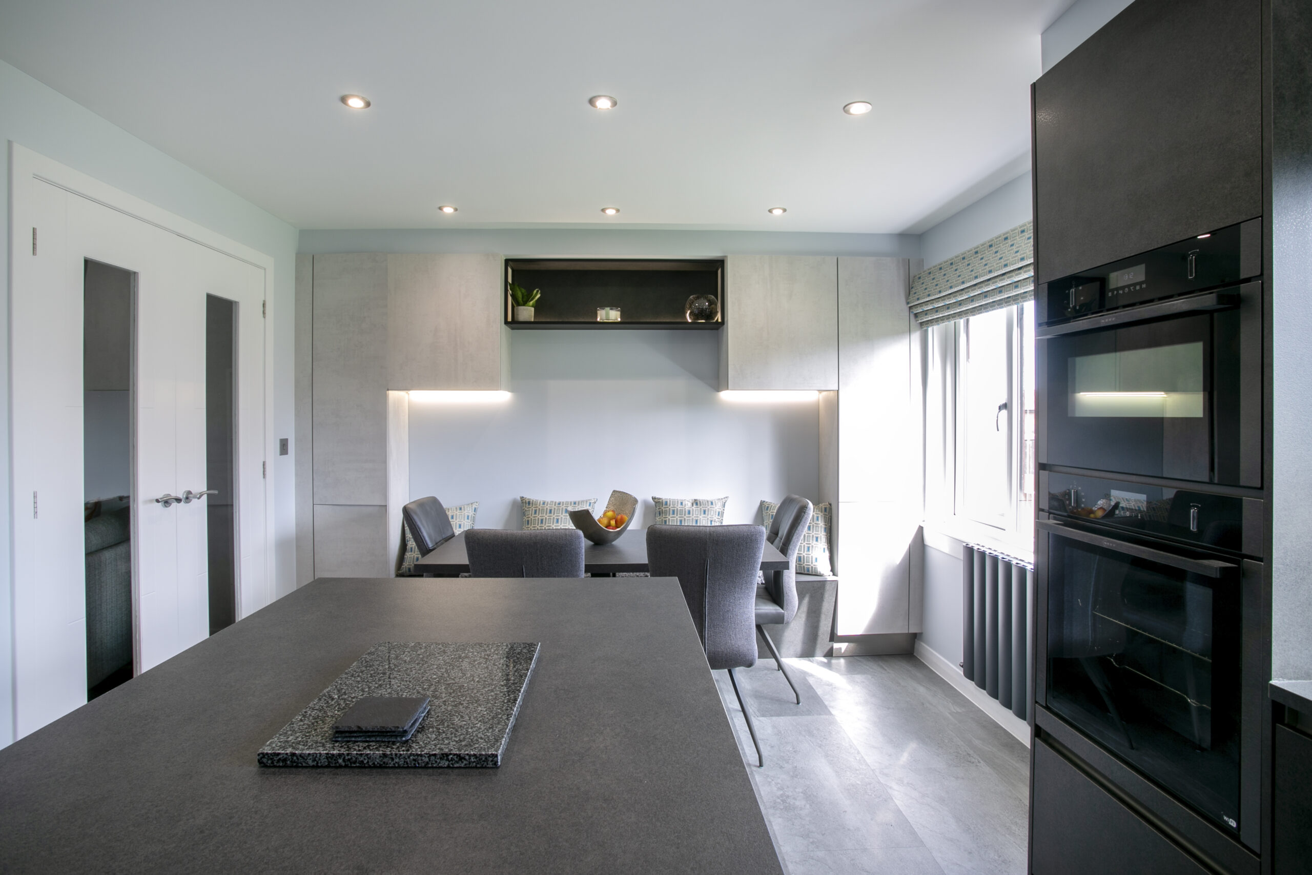 Kitchen and Dining space with fitted storage. Storage and style in peterhead. open plan kitchen diner with an island in peterhead, aberdeenshire. John Willox Kitchen Design Aberdeen. Ellon.