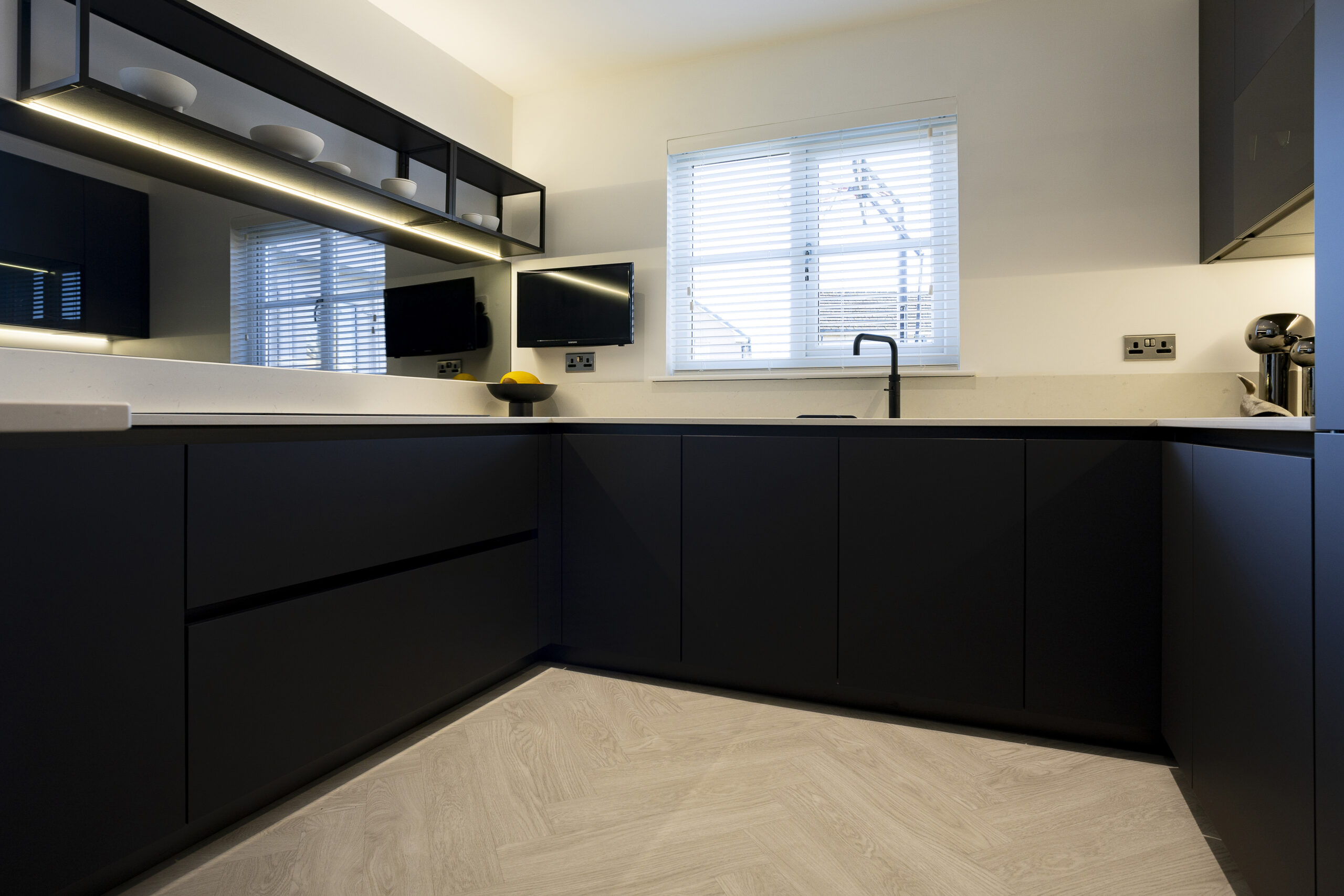 Black vs White Kitchen with smoked grey mirror splashback, by John Willox Kitchen Design, Ellon.