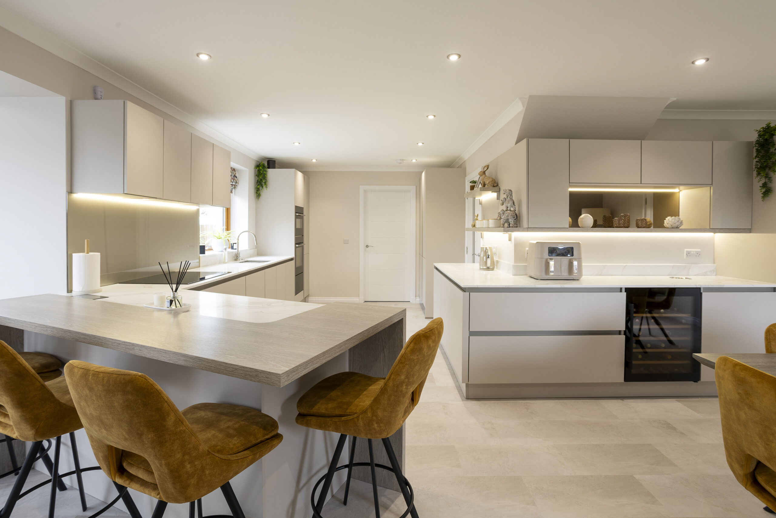 Zoning spaces. Dining, Cooking, Breakfast, bar area. Family Focused Kitchen, Warm neutrals, John Willox Kitchen Design, Ellon, Aberdeen. Facebook Schema Image