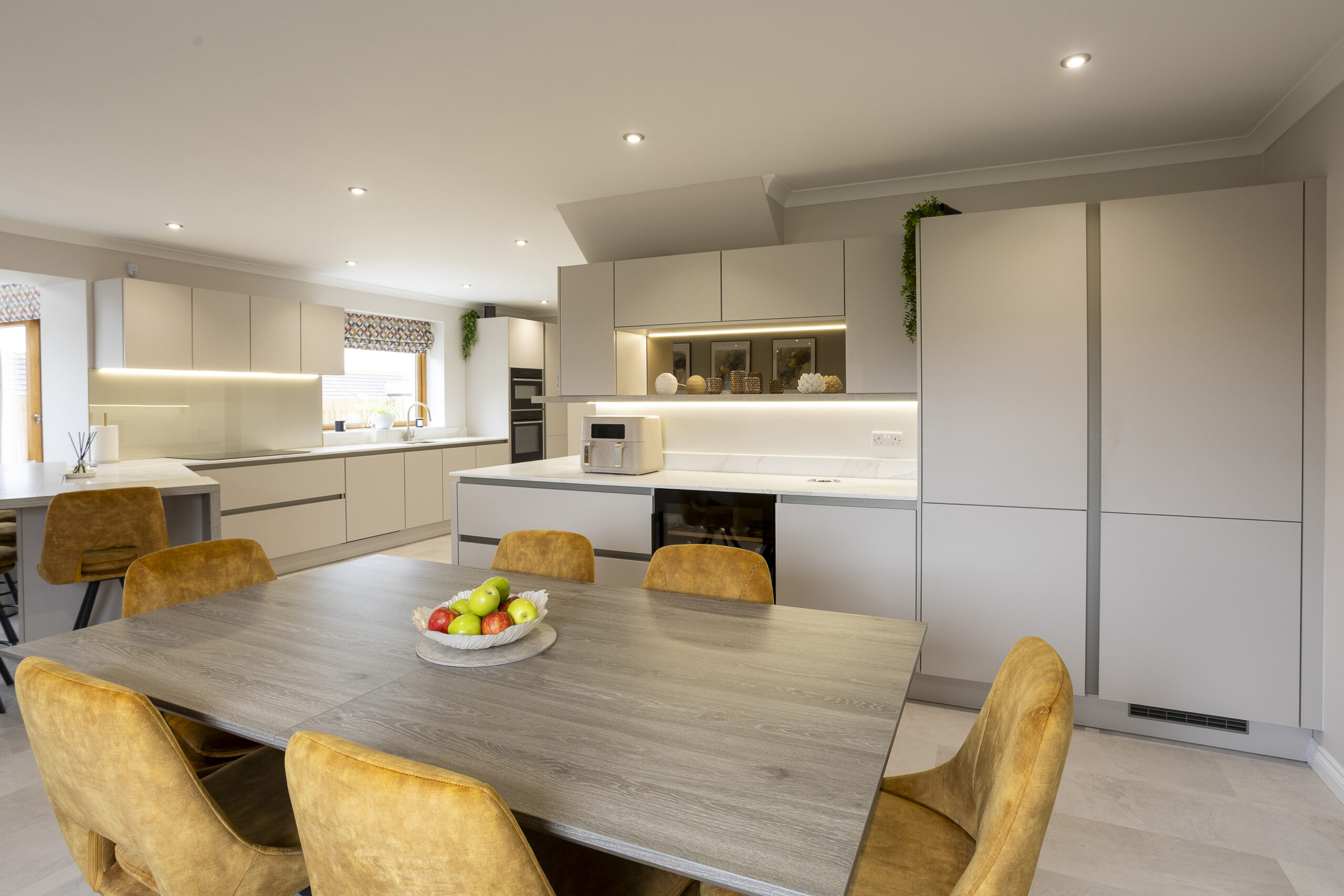 Wine Fridge close to the dining space. Storage. Family Focused Kitchen, Warm neutrals, John Willox Kitchen Design, Ellon, Aberdeen. Facebook Schema Image