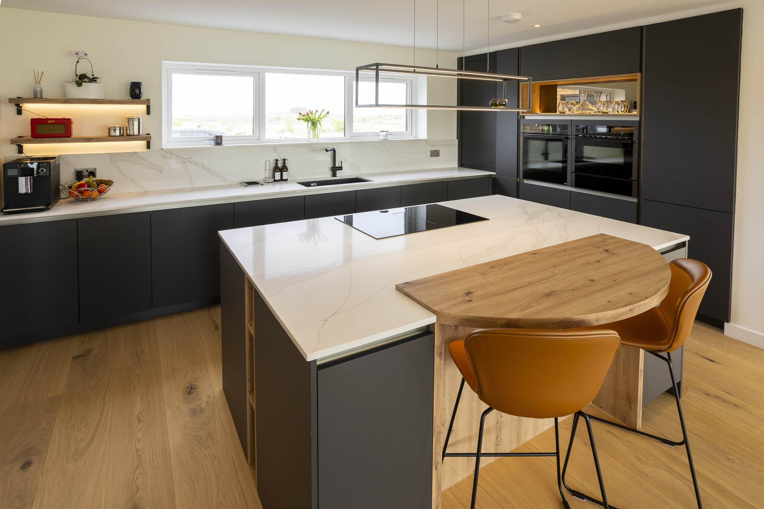 Carbon Black Kitchen. Backlit bronze-mirror shelving. John Willox Kitchen Design, Ellon, Aberdeen.