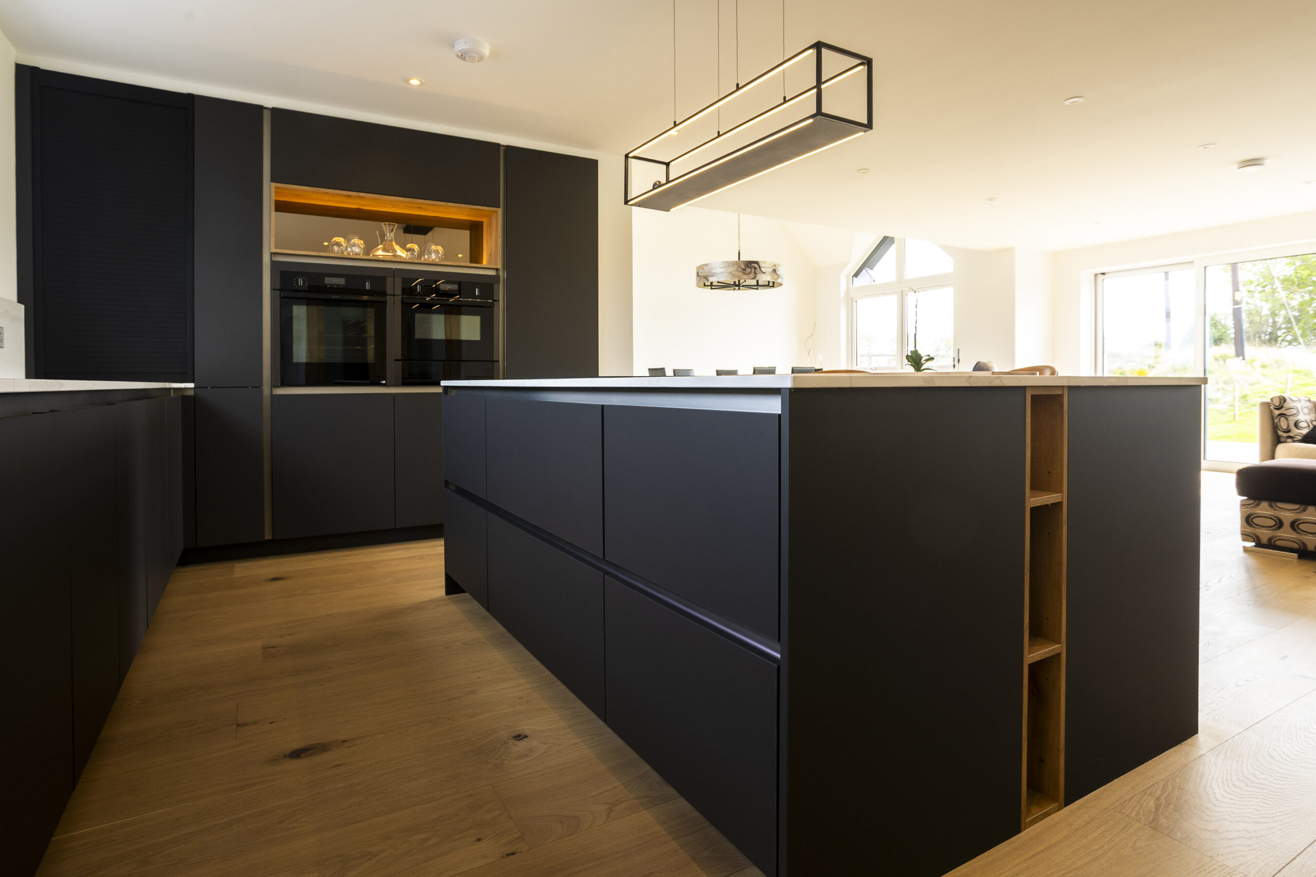 Carbon Black Kitchen. Warm oak accents. Open Plan. John Willox Kitchen Design, Ellon, Aberdeen.