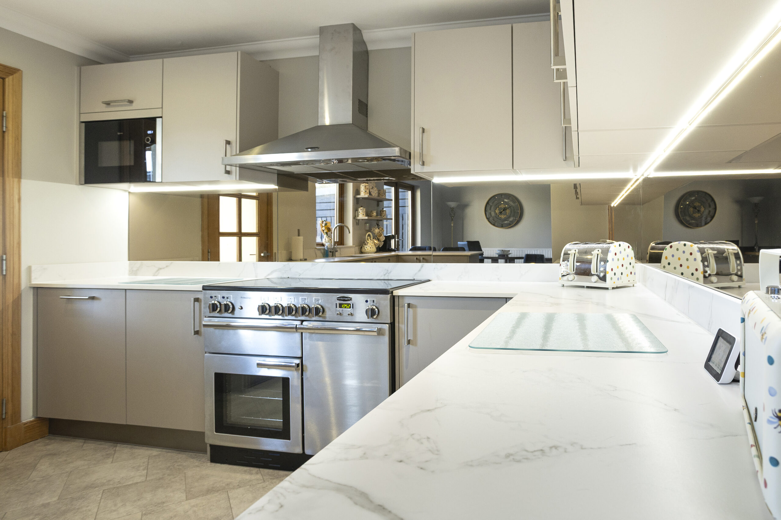Quiet Elegance. John Willox Kitchen Design L-Shaped Peninsula. Burger Cindy in Sand Beige Cabinetry. Rangemaster Stainless Range Cooker and Hood. Aberdeen Kitchen Project.